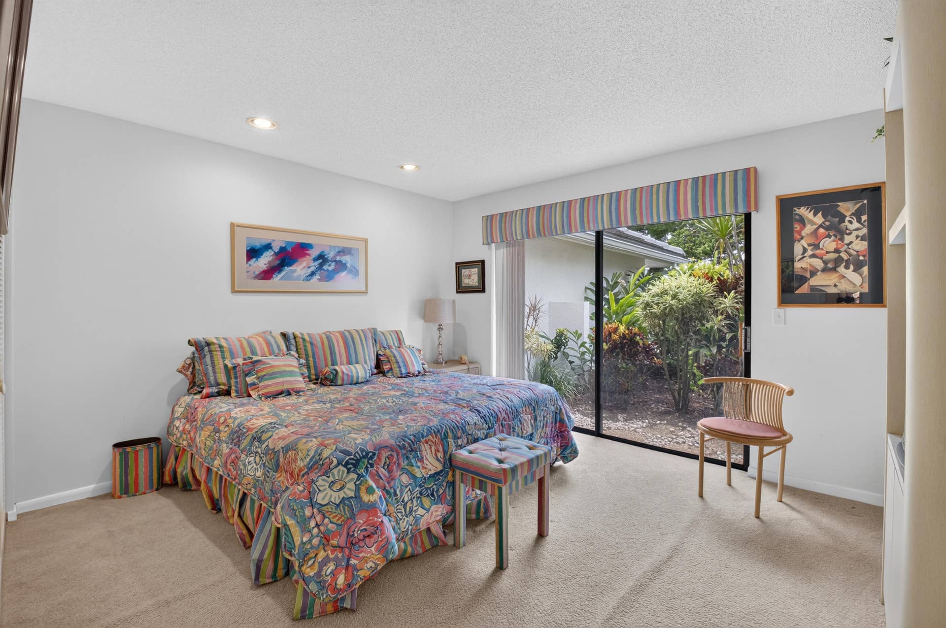 20065 Waters Edge Drive, #101, Boca Raton, FL 33434 Recessed lighting, sliding glass door, outdoor landscaping, built-in shelving, and carpeted flooring
