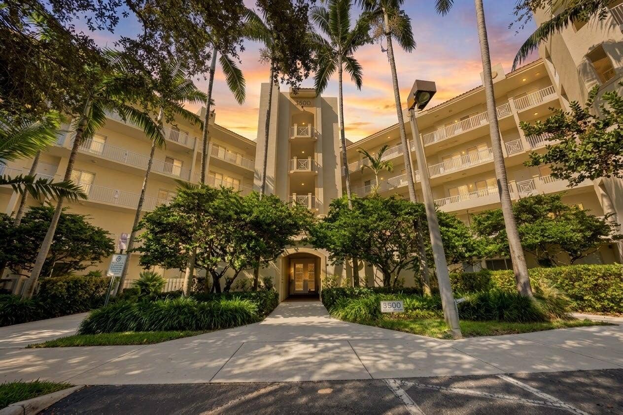 3500 OAKS CLUBHOUSE Drive, #510, Pompano Beach, FL 33069 front building sunset