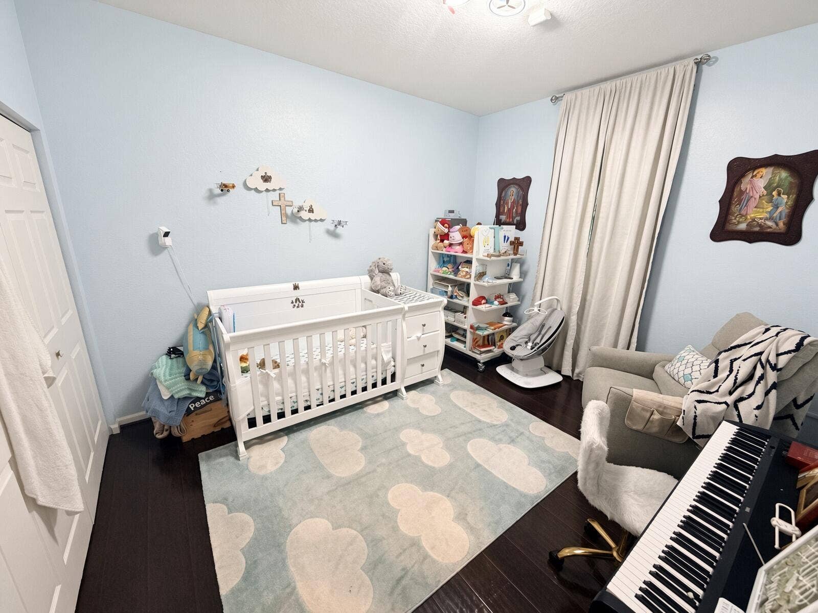 Dark flooring with light blue wall paint