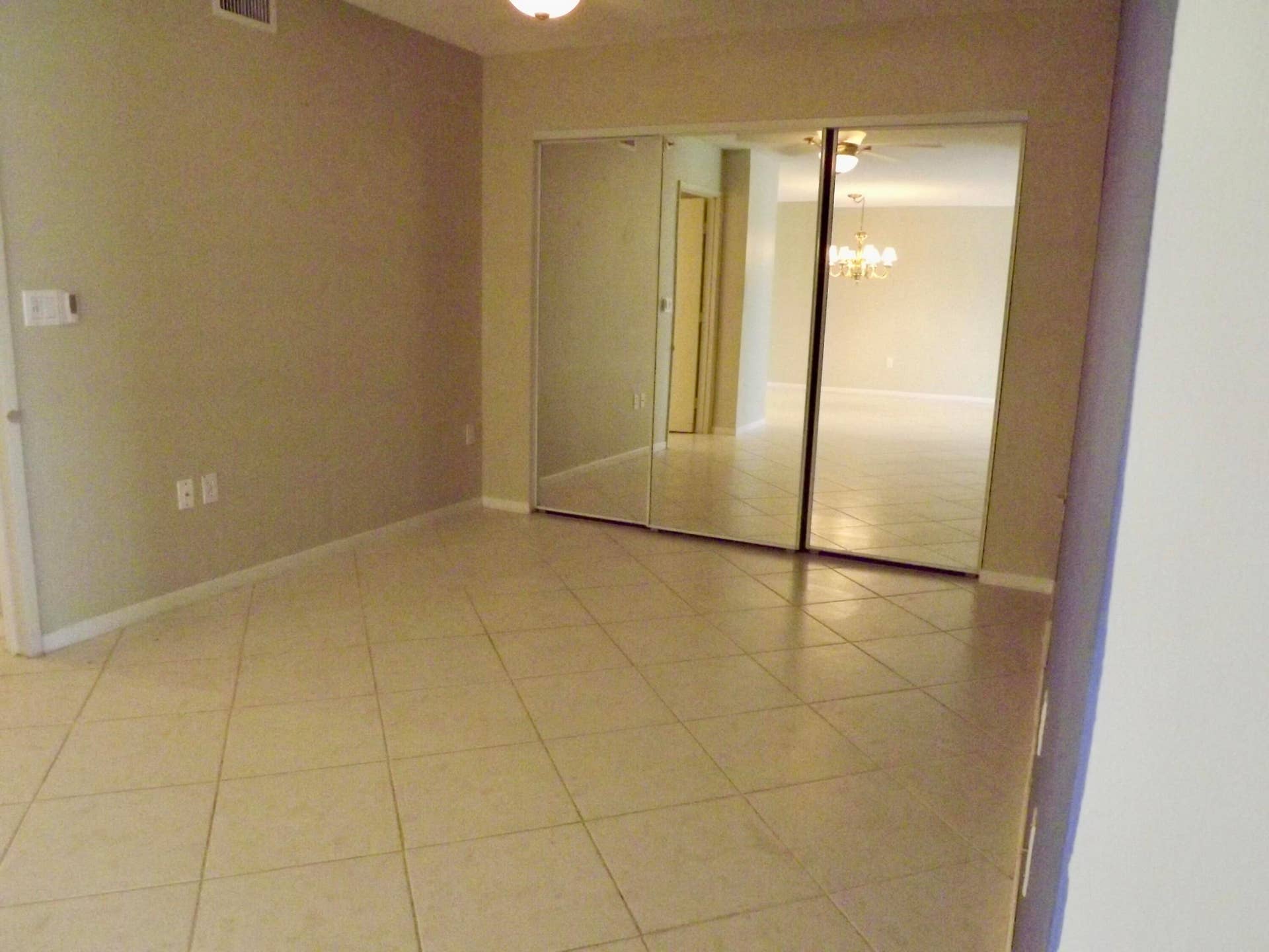 den/home office with large closet for additional storage