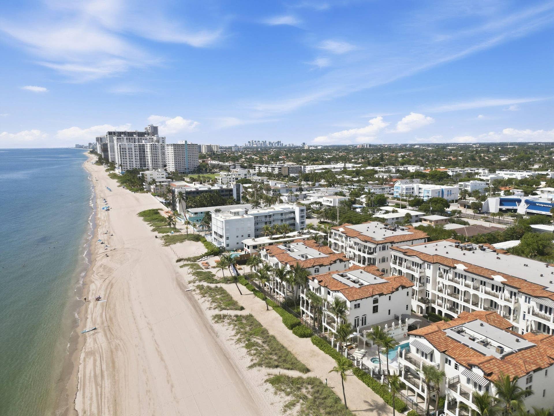Expansive beachfront with sandy shores and ocean