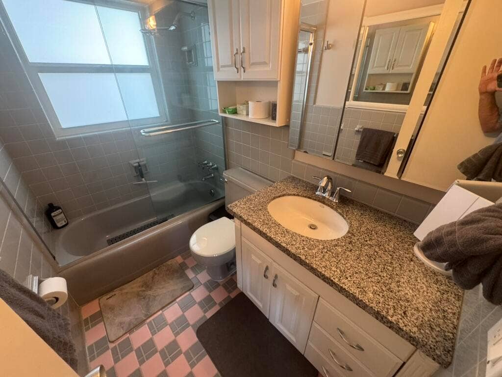 180 Isle Of Venice Drive, #433, Fort Lauderdale, FL 33301 Bathroom featuring a white vanity with a speckled countertop, an integrated sink, and white cabinetry