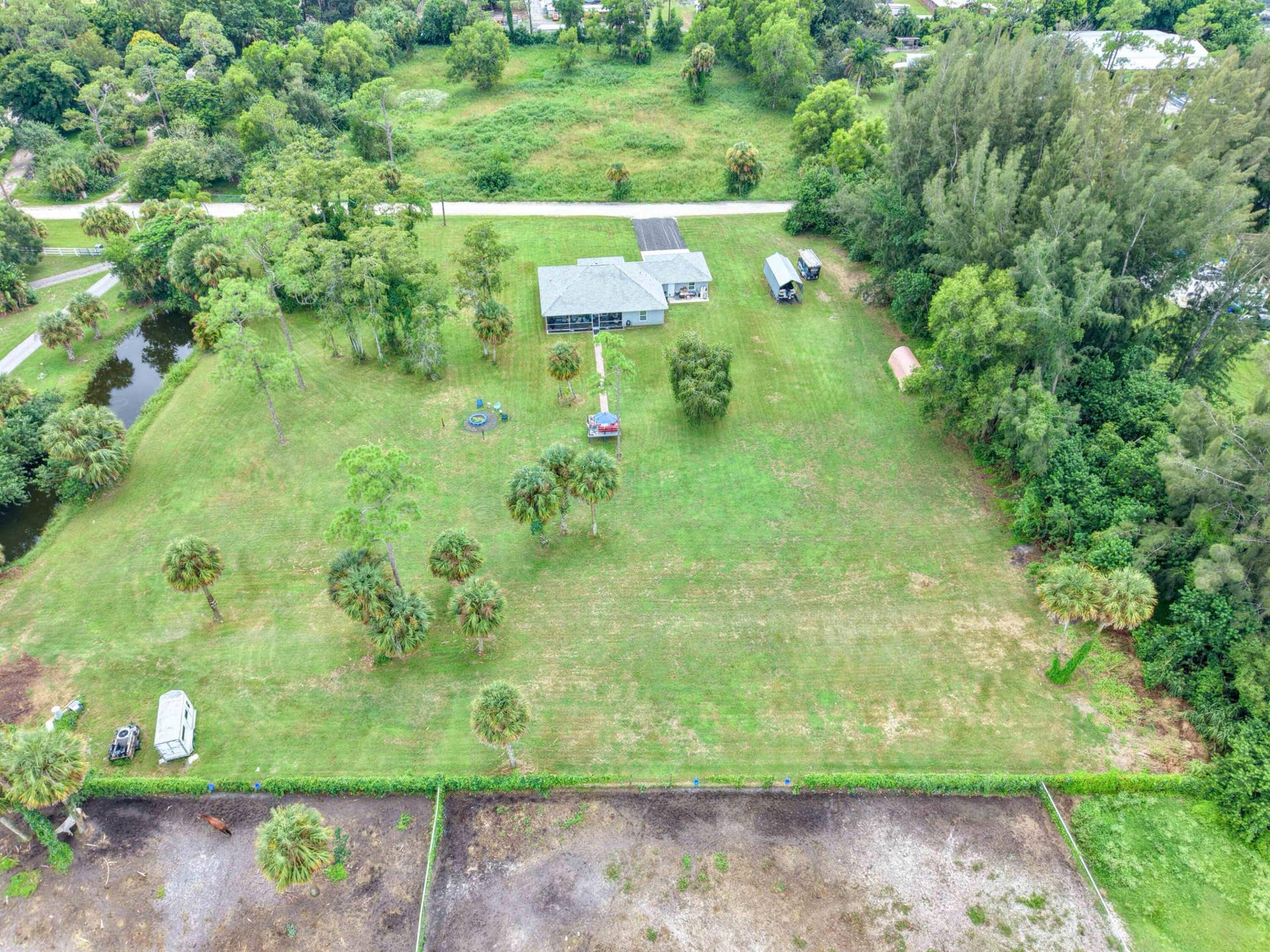 14171 BIDDEX Road, Loxahatchee Groves, FL 33470 Drone Rear