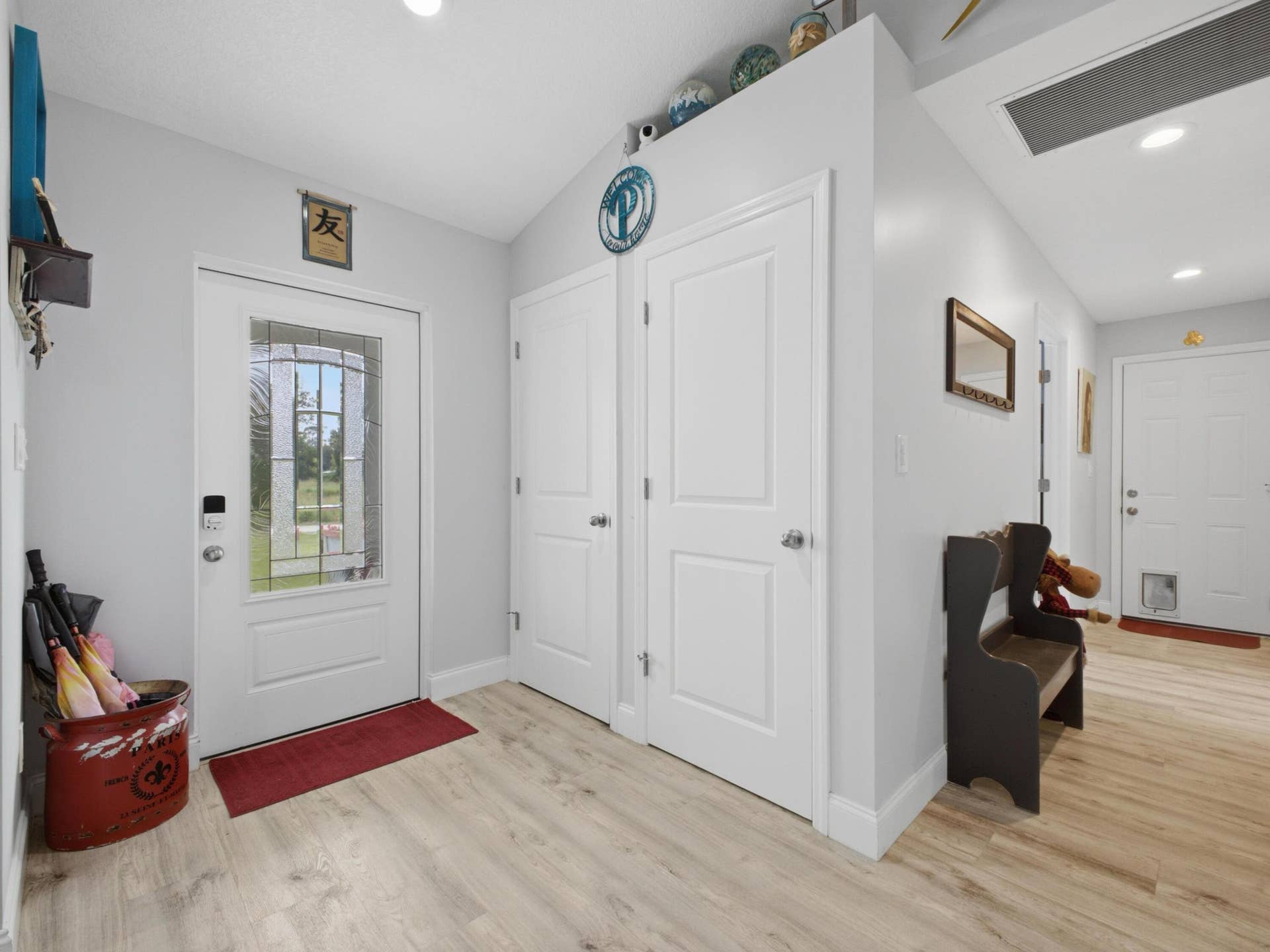 14171 BIDDEX Road, Loxahatchee Groves, FL 33470 Foyer Hallway to Laundry Garage