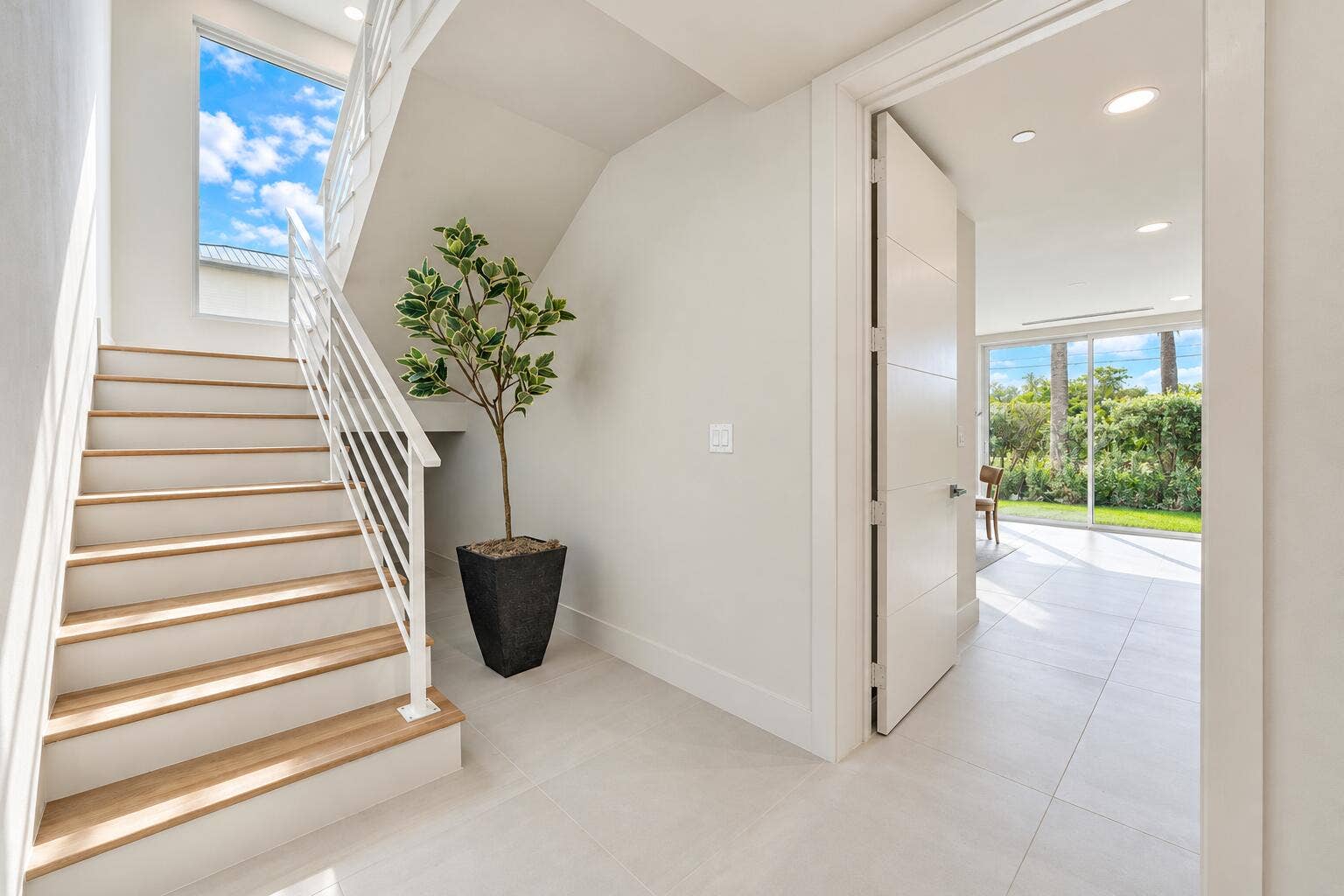 Bright Modern Stairwell with Tropical Vi