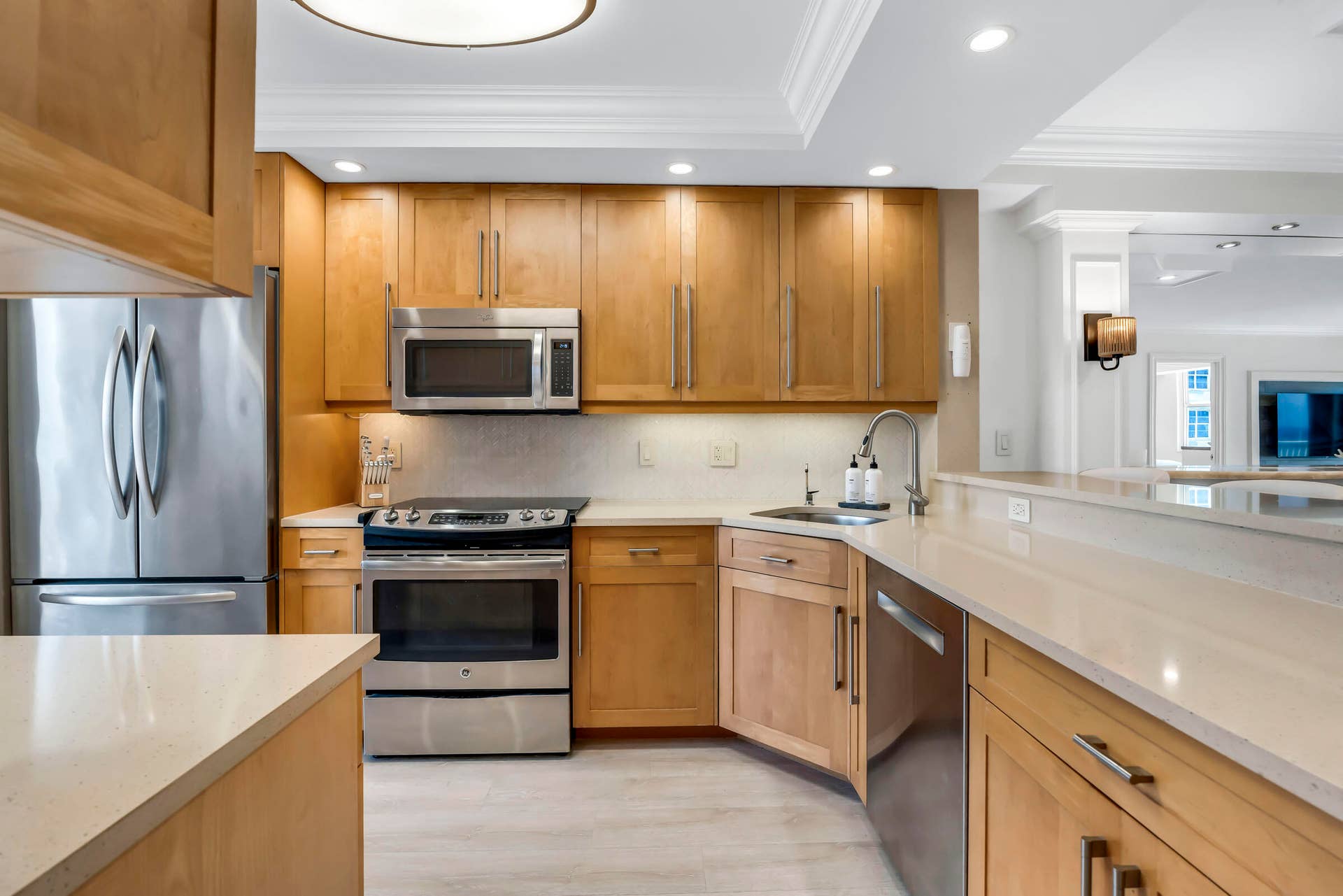 Custom kitchen opens to the dining and living areas to create a bright and spacious layout.