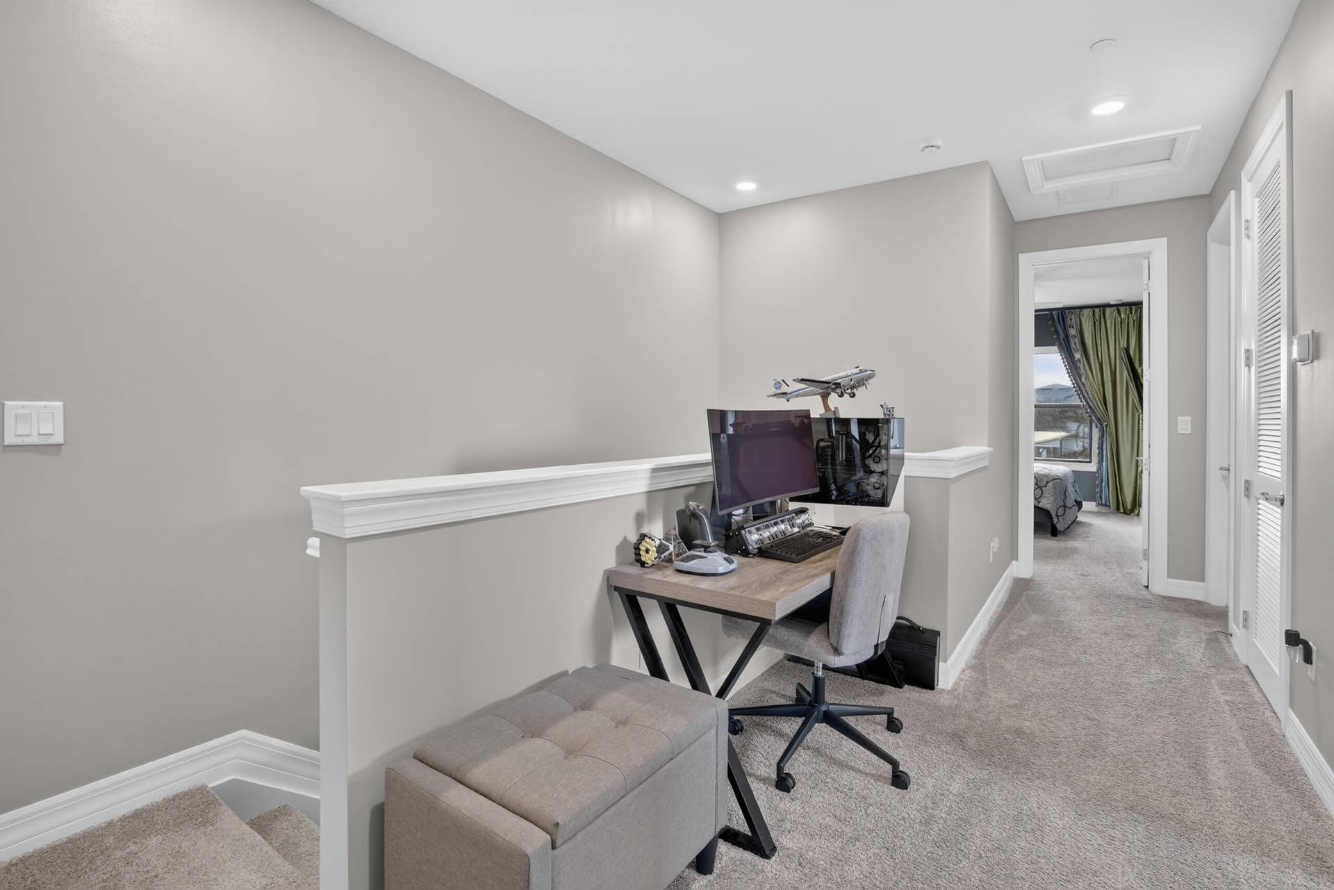 765 NW 84TH Terrace, Plantation, FL 33324 Carpeted loft area featuring recessed lighting, a white painted half-wall, and a ceiling access panel