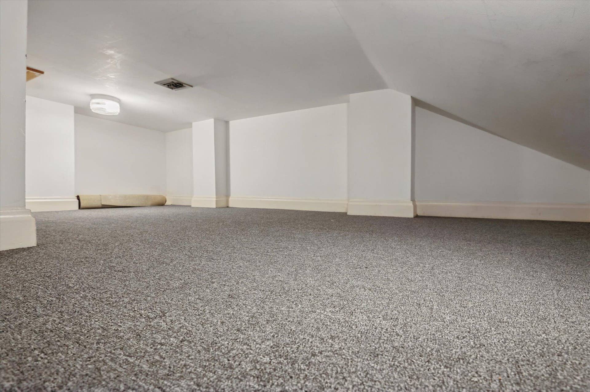 4120 SW 1ST Court, Plantation, FL 33317 Pull-down stairs in closet lead to this carpeted, air-conditioned storage area that is above the 2 closets and dressing areas in the back primary bedroom.
