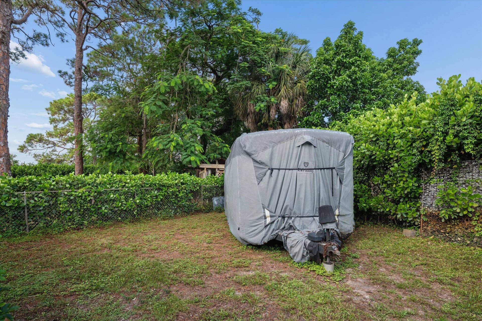 4120 SW 1ST Court, Plantation, FL 33317 Separate, fenced side yard with privacy fence and 14'-wide, double gates, perfect for boat or trailer