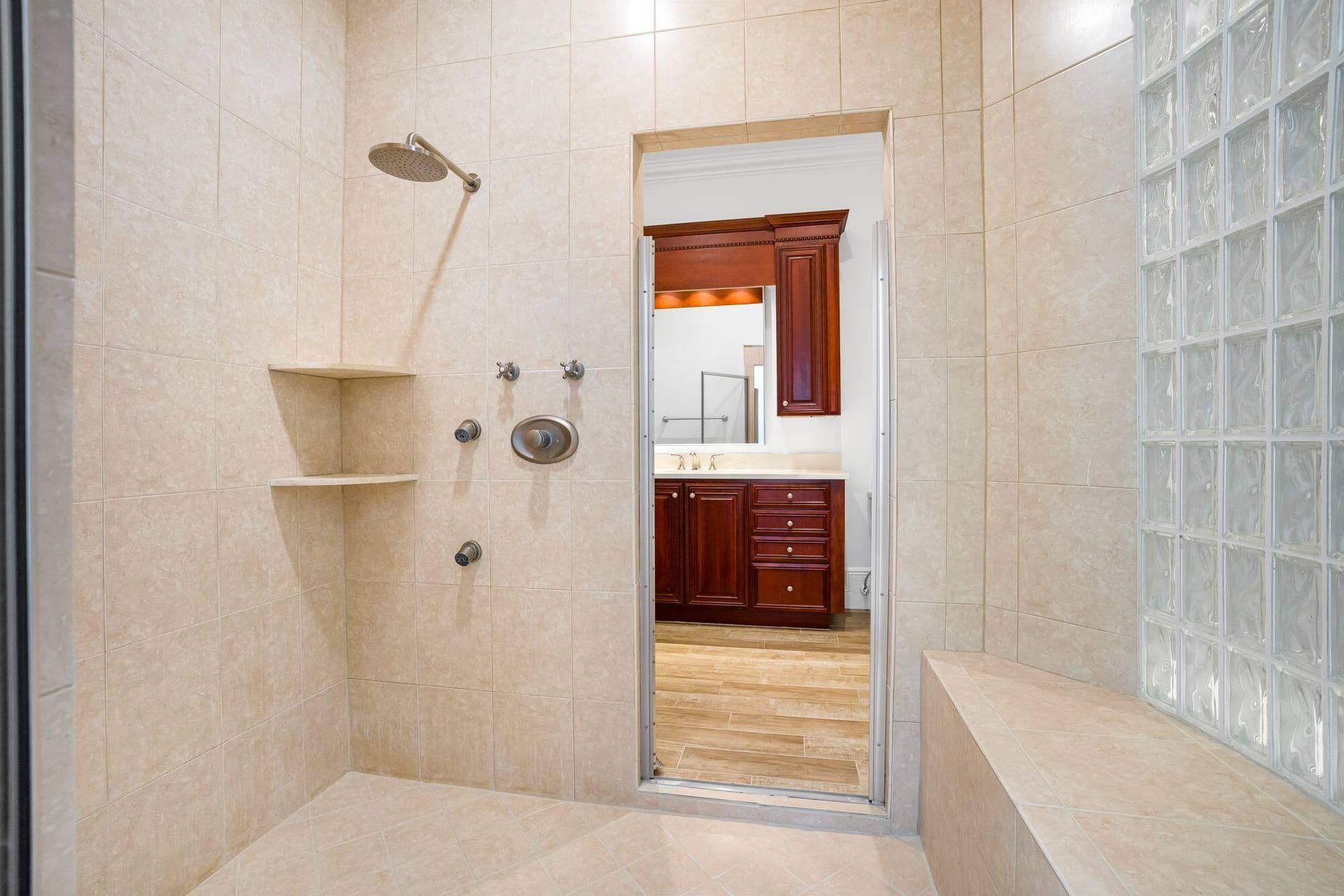 PRIMARY SUITE FEATURING SEPARATE HIS AND HER BATH AREAS WITH GENEROUS WALK IN CLOSET SPACE