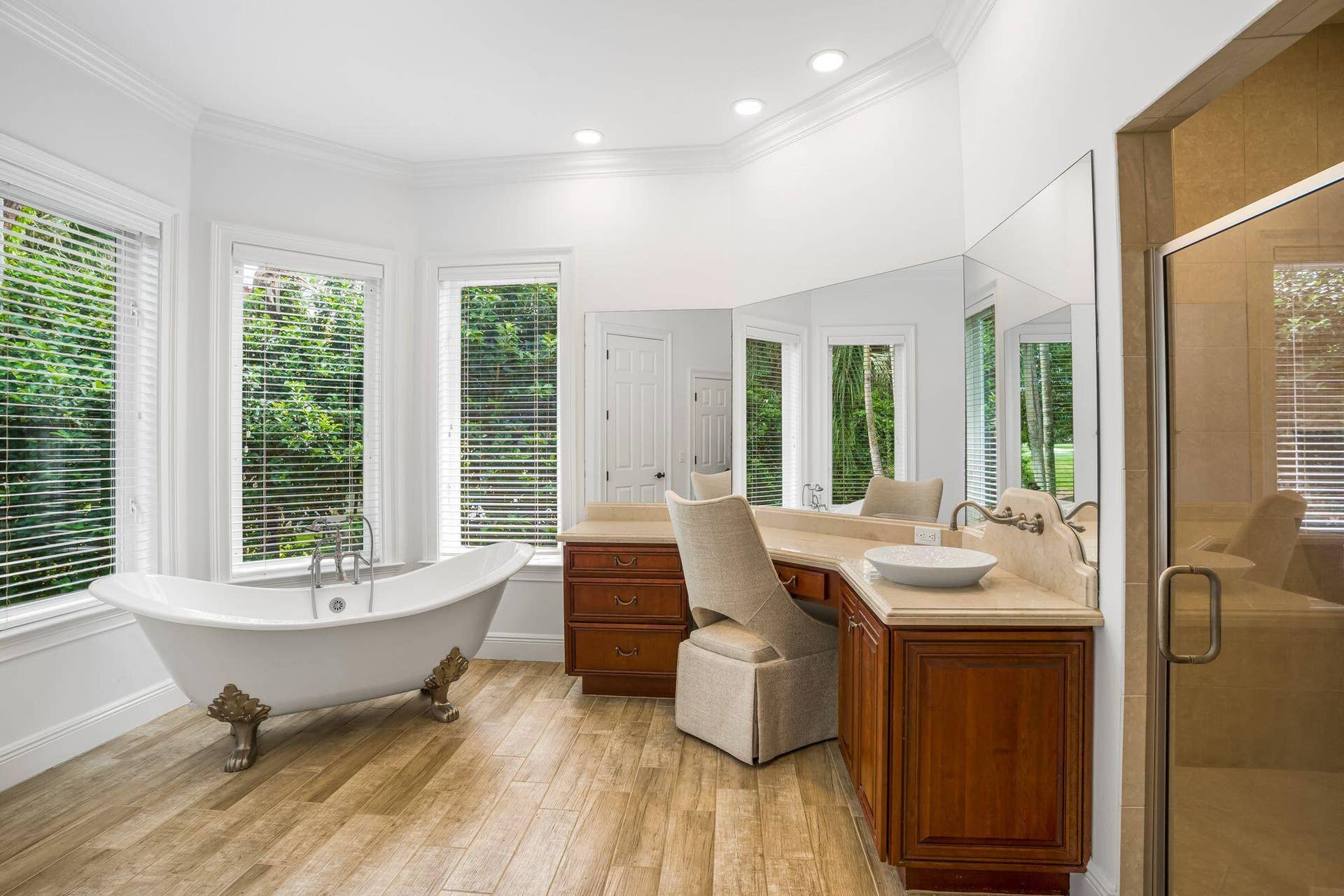 PRIMARY SUITE FEATURING SEPARATE HIS AND HER BATH AREAS WITH GENEROUS WALK IN CLOSET SPACE