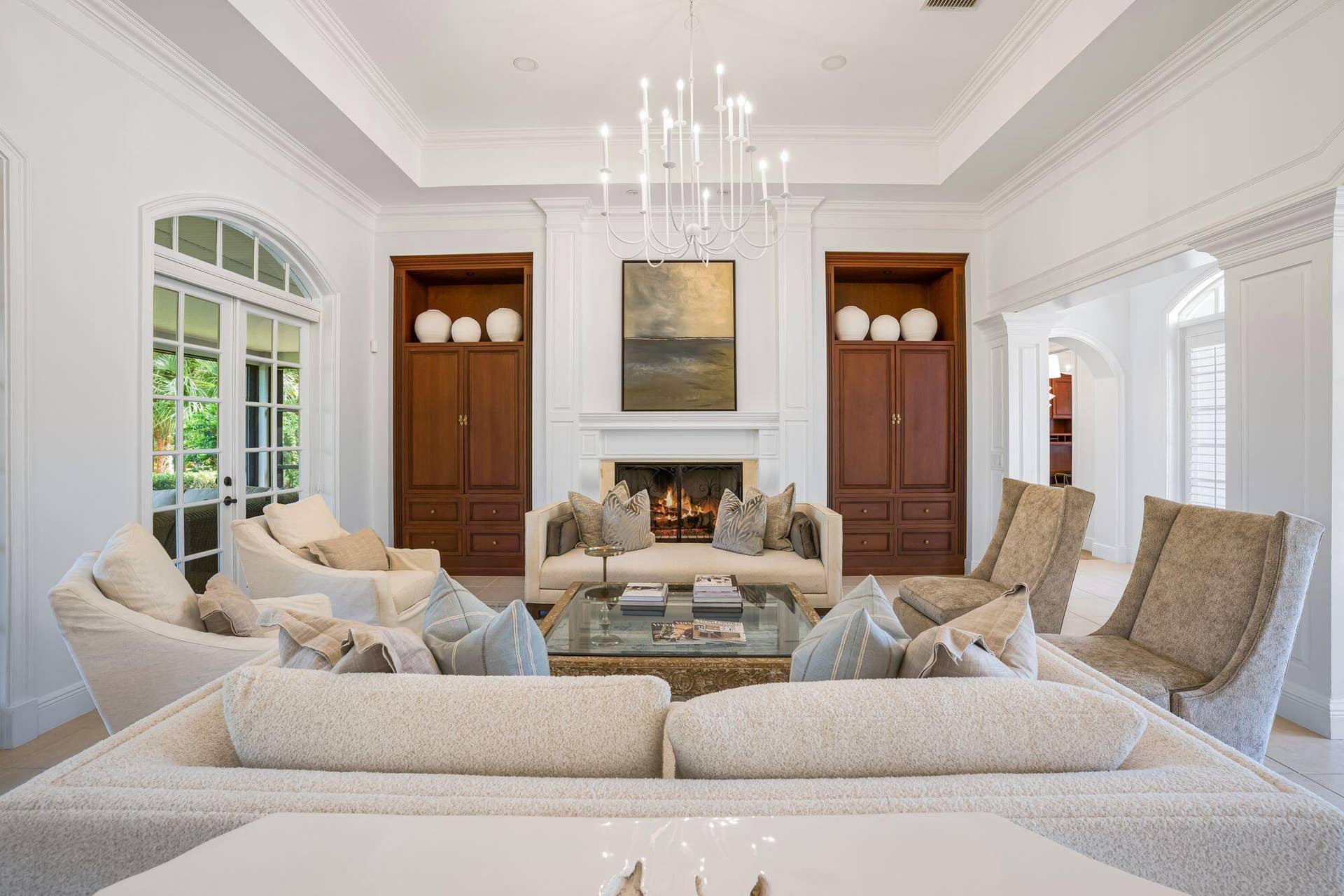 ELEGANT GREAT ROOM WITH SOARING CEILINGS, CUSTOM BUILT-INS AND FIREPLACE
