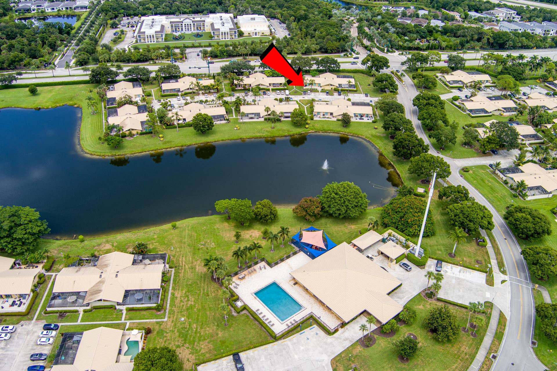 Property situated within a residential community featuring a prominent lake with a fountain