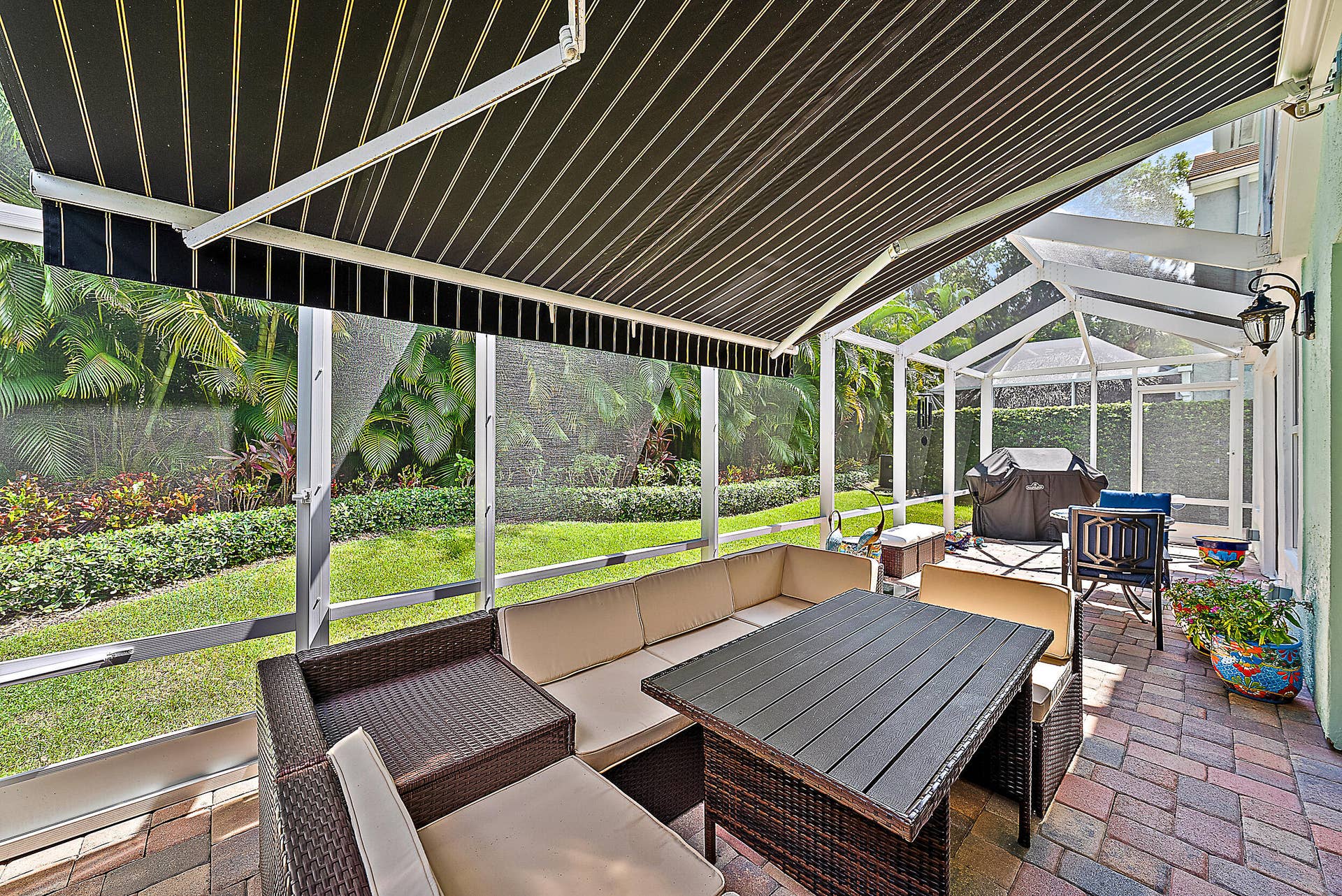 7 Grand Bay Circle, Juno Beach, FL 33408 Screened Patio with Retractable Awning