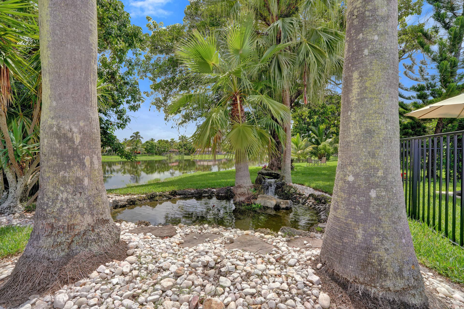 12072 NW 27TH Drive, Coral Springs, FL 33065 pond with working waterfall