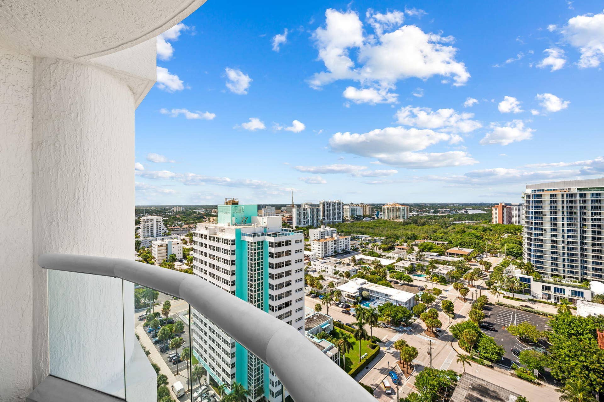 551 N FORT LAUDERDALE BEACH Boulevard, #R1801, Fort Lauderdale, FL 33304 Expansive balcony with glass panel railing and painted stucco exterior