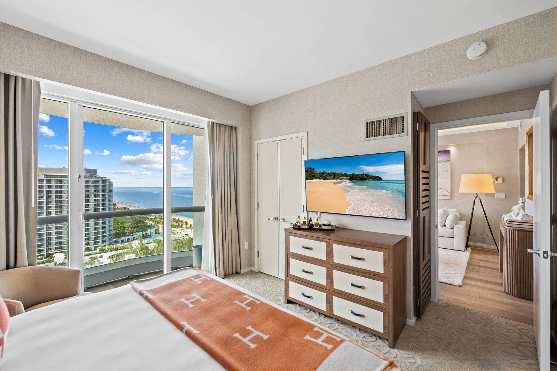 551 N FORT LAUDERDALE BEACH Boulevard, #R1801, Fort Lauderdale, FL 33304 Sliding glass doors opening to a balcony, offering expansive water and cityscape scenery