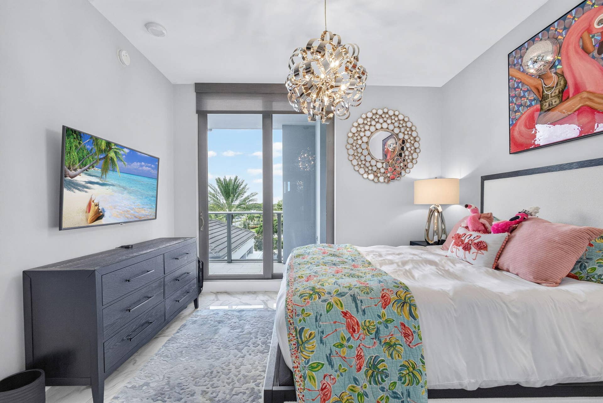 1 Water Club Way, #503, North Palm Beach, FL 33408 inviting guest bedroom with sliding glass door, private balcony with an ensuite bathroom and closet.