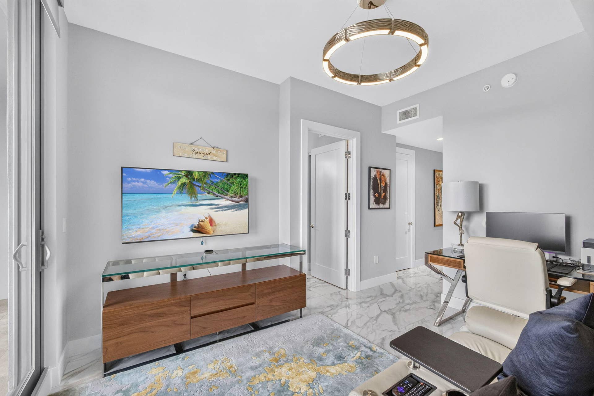 1 Water Club Way, #503, North Palm Beach, FL 33408 Recessed lighting, light gray wall paint, and white trim throughout. Comfy TV den and office space