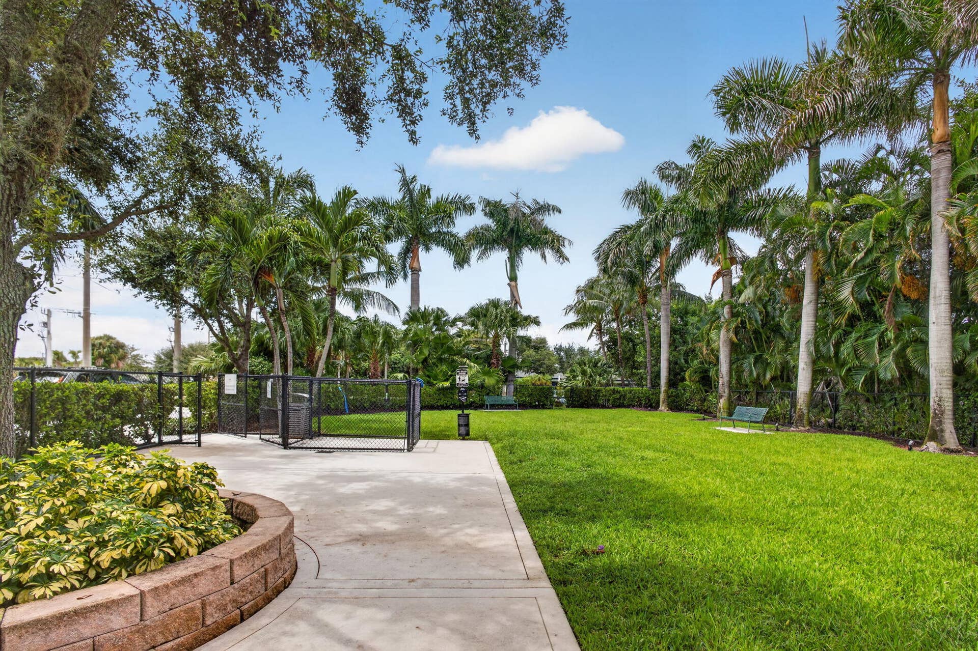 1 Water Club Way, #503, North Palm Beach, FL 33408 You must see this fenced safe, private, well-maintained dog park for all of the fur kids who stay at the Water Club. This is within ear shot of the manned main gate house.