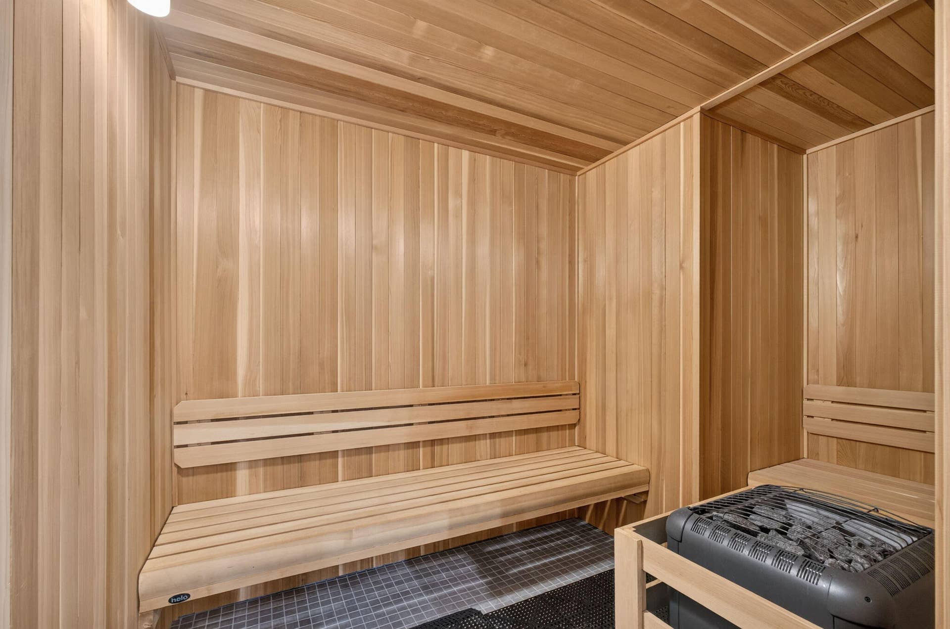 1 Water Club Way, #503, North Palm Beach, FL 33408 Wood-paneled sauna featuring multiple wooden benches and a built-in electric heater