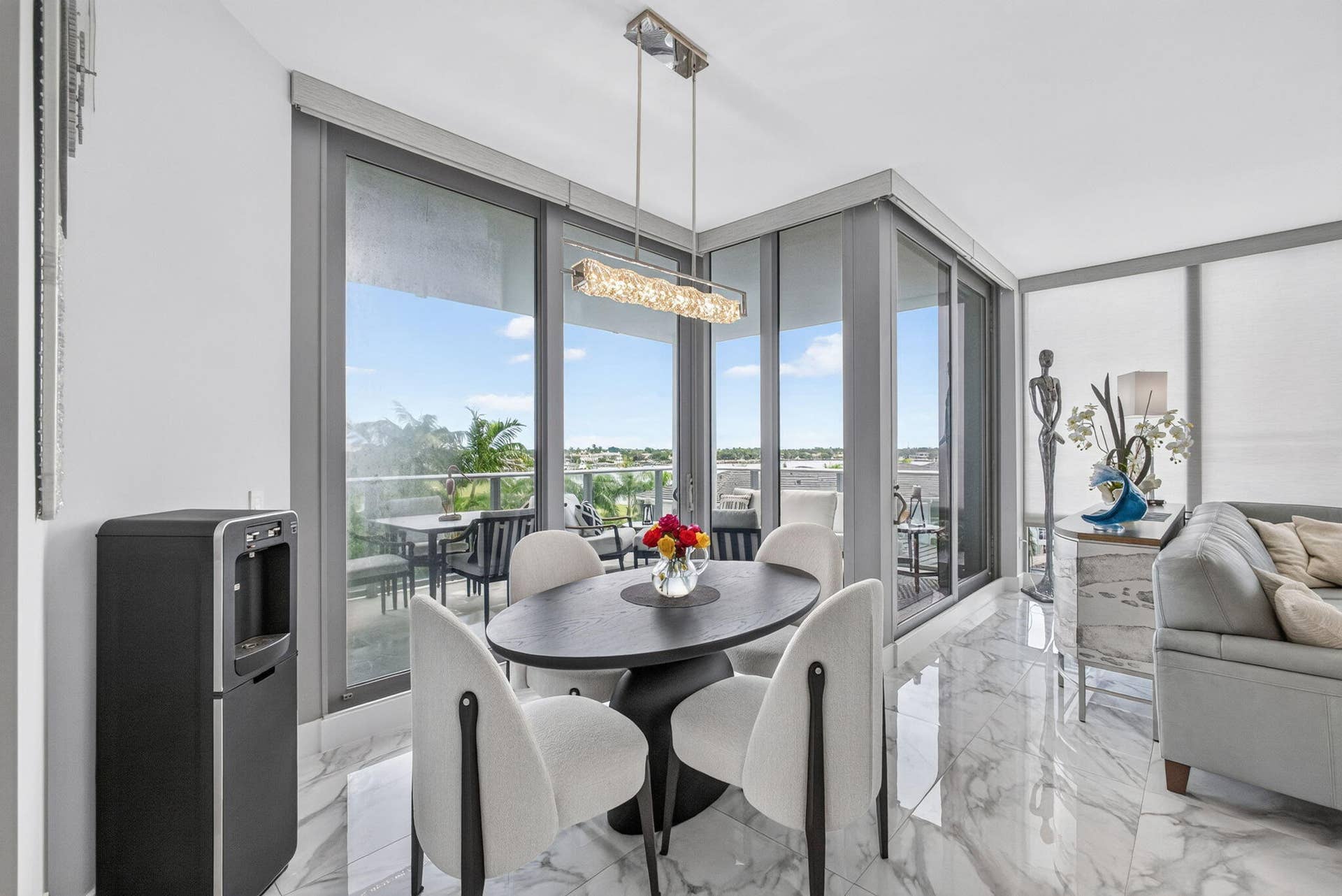 1 Water Club Way, #503, North Palm Beach, FL 33408 Spacious interior featuring marble-finish flooring and expansive sliding glass doors, enjoy the breathtaking views while dining with your guests!