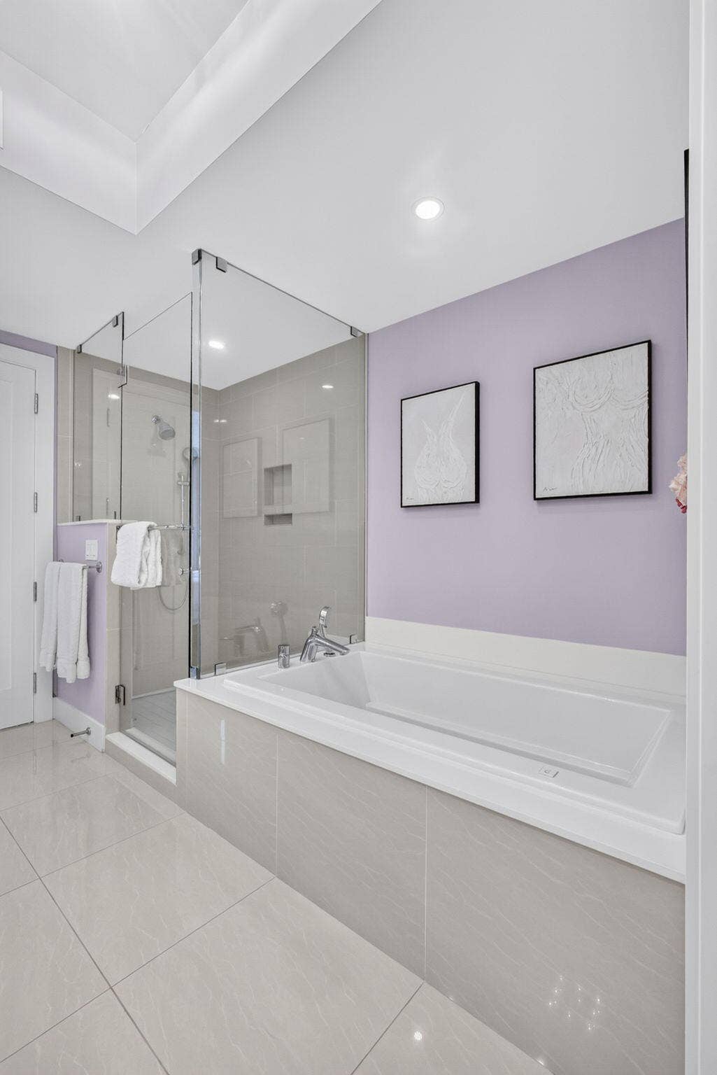 1 Water Club Way, #503, North Palm Beach, FL 33408 Walk-in shower with glass enclosure, built-in soaking tub with tile surround, recessed lighting, and large format floor tiling
