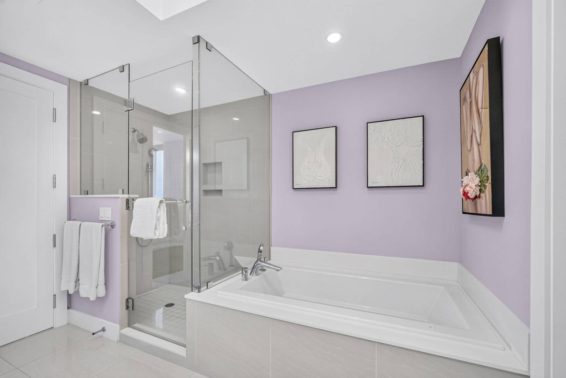 1 Water Club Way, #503, North Palm Beach, FL 33408 Glass-enclosed shower, built-in bathtub, light purple wall finish, recessed lighting, and tile flooring