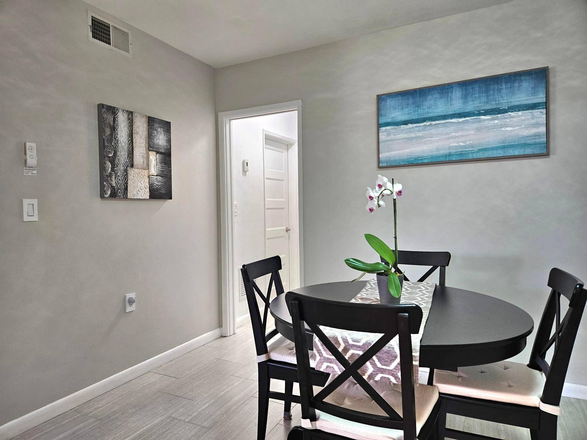 VIEW OF DINING AREA LEADING TO BATHROOM AND BEDROOM