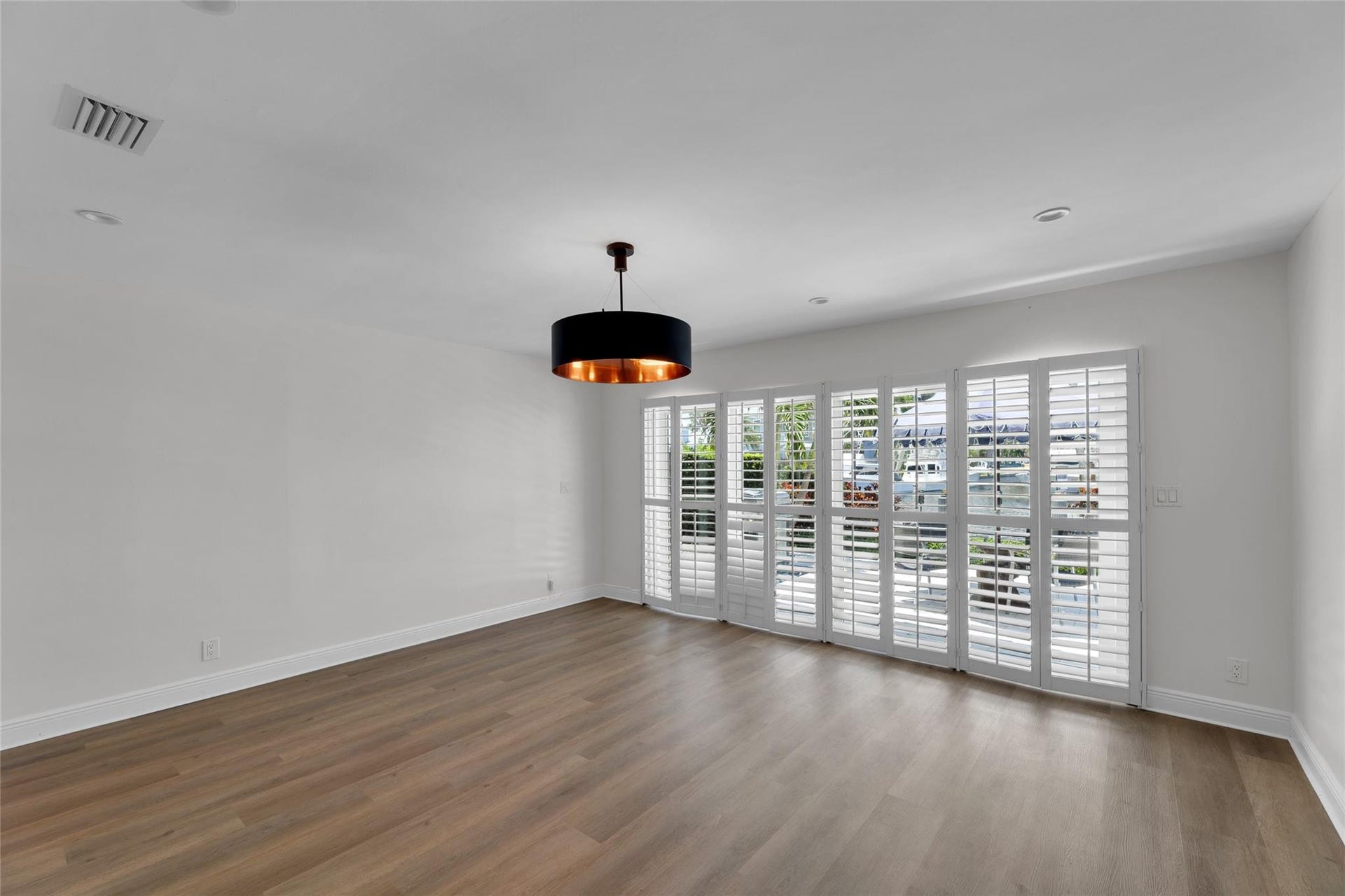 2401 NE 47TH Street, Lighthouse Point, Lighthouse Point, FL 33064 Master Bedroom with plantation shutters and pool and water views with access to backyard
