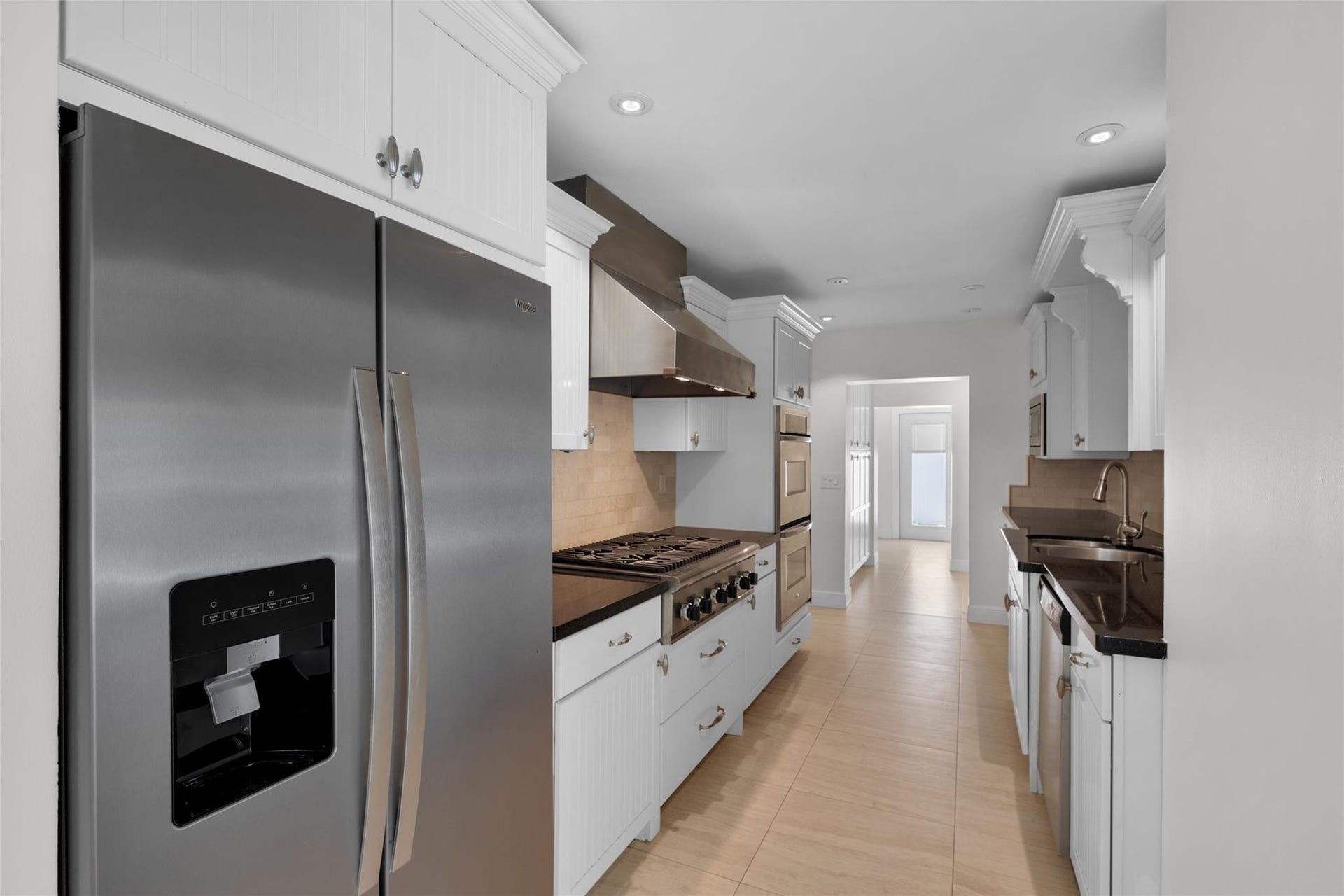 2401 NE 47TH Street, Lighthouse Point, Lighthouse Point, FL 33064 Stainless appliances and tons of storage offered in kitchen