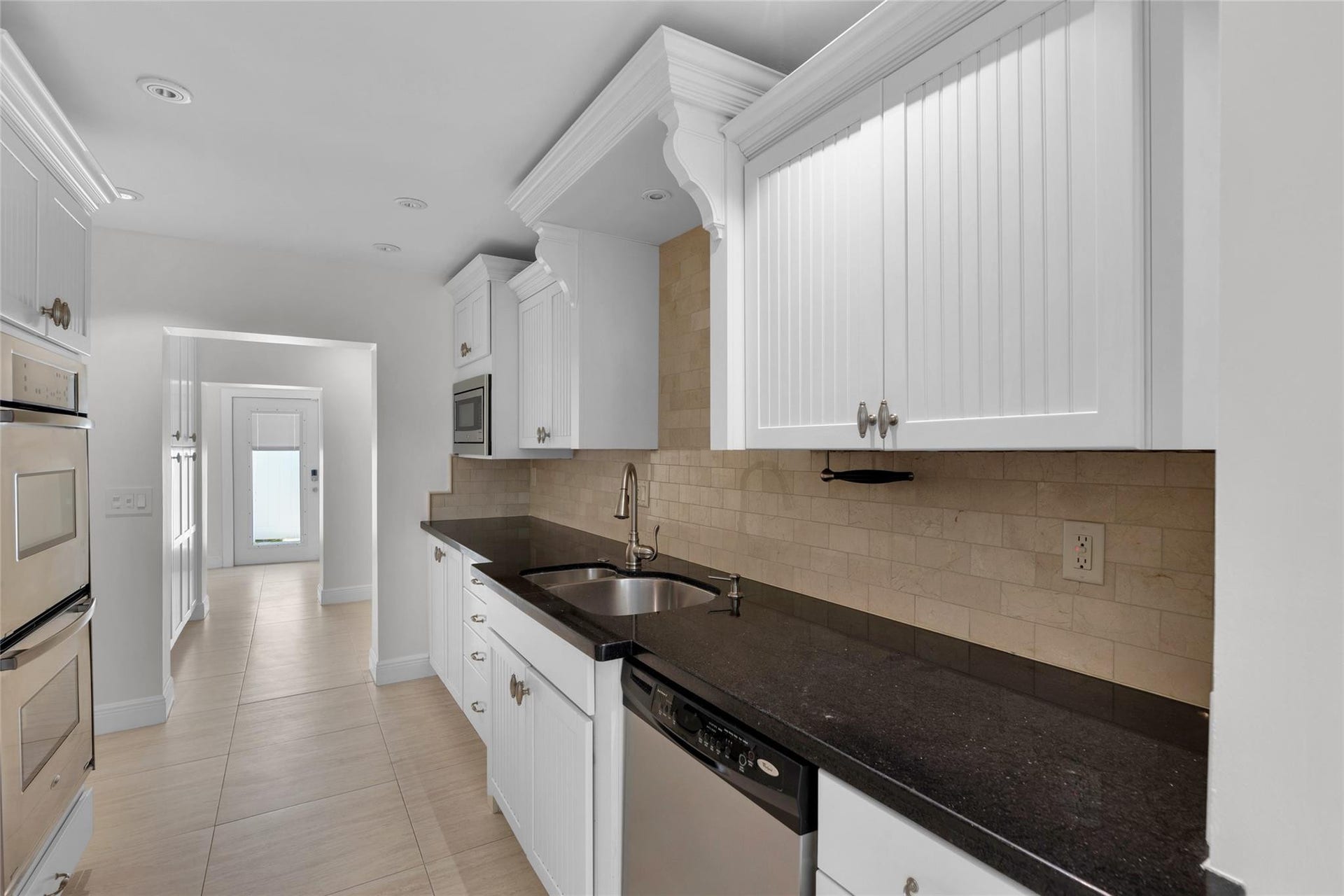 2401 NE 47TH Street, Lighthouse Point, Lighthouse Point, FL 33064 White counters offer tons of storage in kitchen