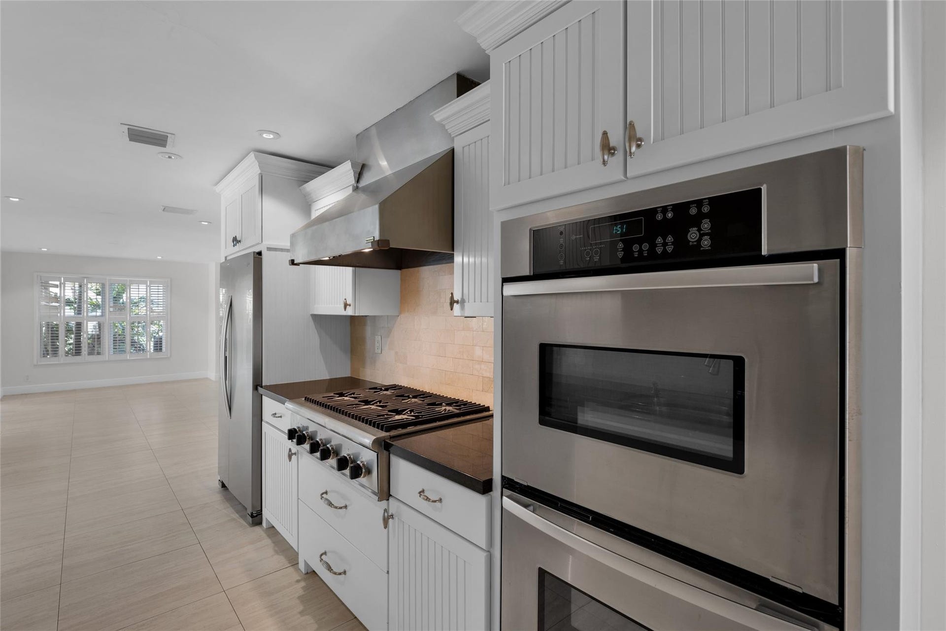 2401 NE 47TH Street, Lighthouse Point, Lighthouse Point, FL 33064 Double oven and gas range stove featured in kitchen