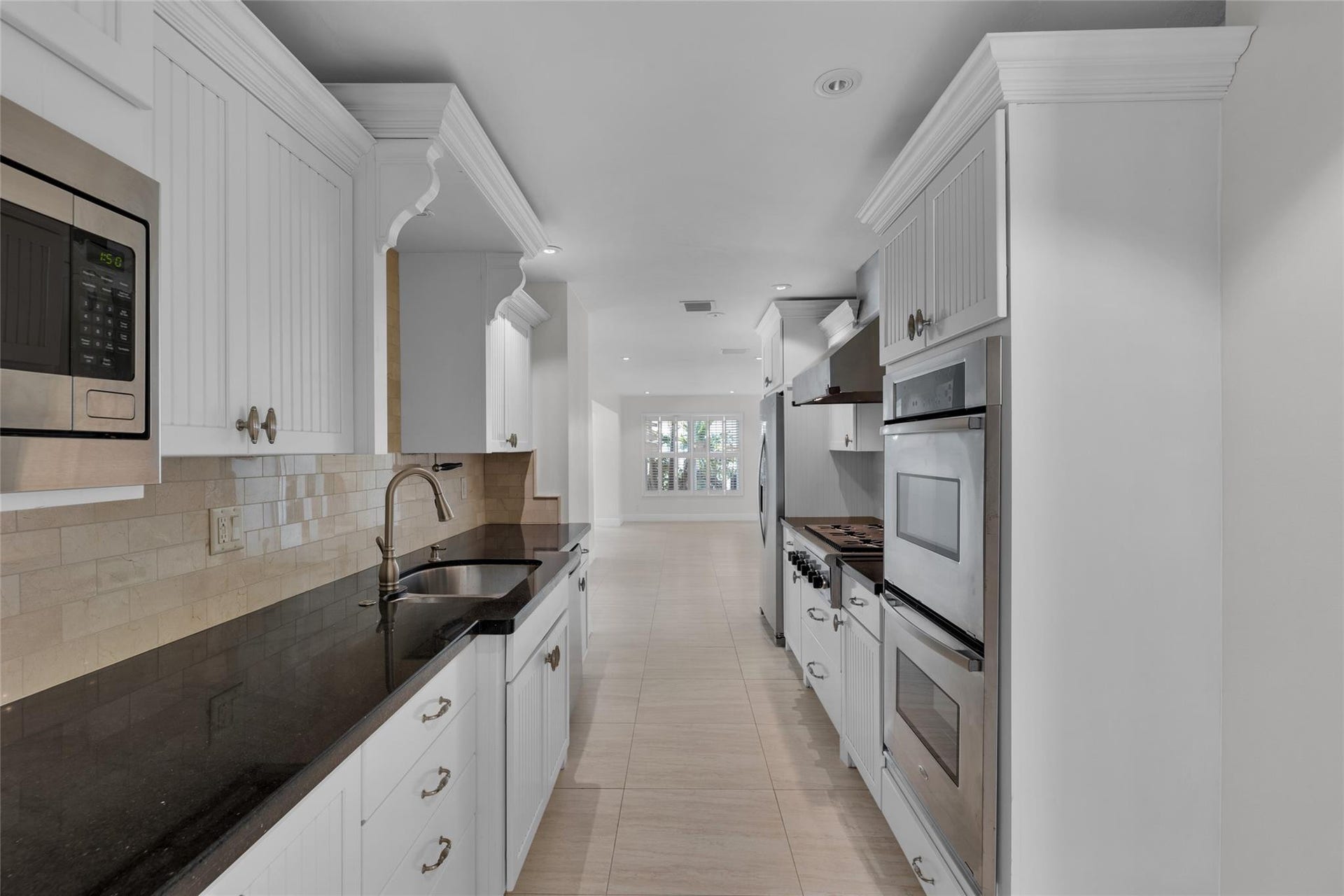 2401 NE 47TH Street, Lighthouse Point, Lighthouse Point, FL 33064 The kitchen offers gas range, double oven, granite counters, stainless appliances and tons of storage