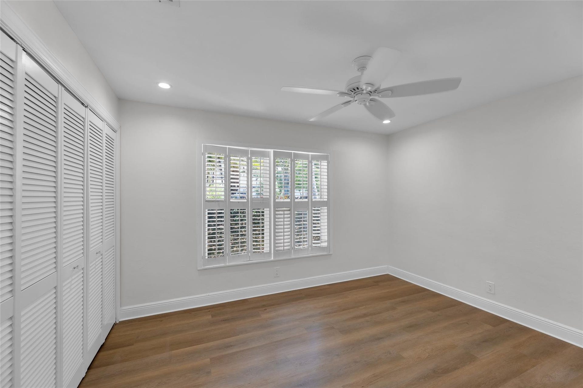 2401 NE 47TH Street, Lighthouse Point, Lighthouse Point, FL 33064 Guest bedroom offers great closet space and plantation shutters