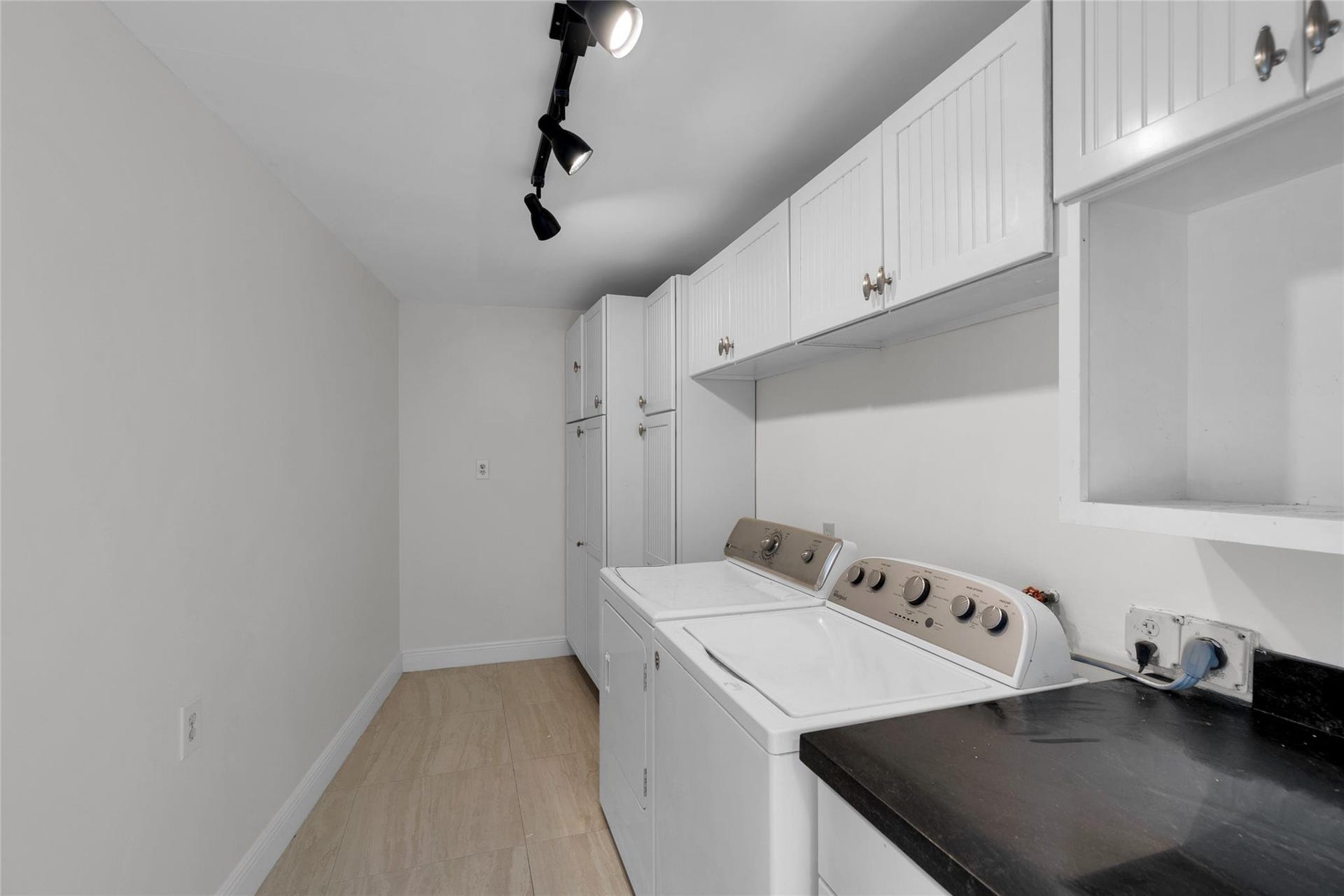 2401 NE 47TH Street, Lighthouse Point, Lighthouse Point, FL 33064 Large indoor laundry room with an abundance of storage