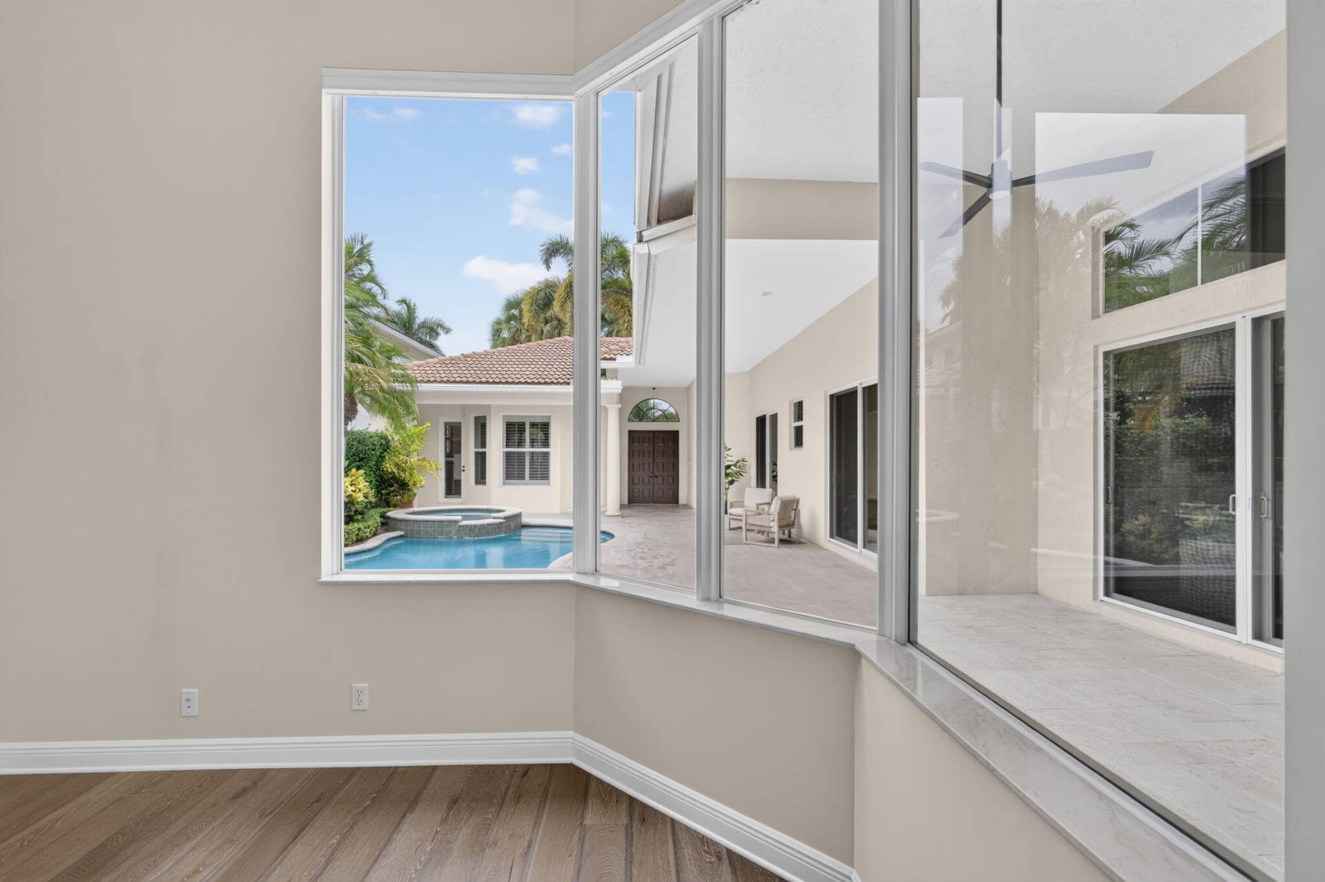 540 Les Jardin Drive, Palm Beach Gardens, FL 33410 Easy to work from this space with a serene view of the pool