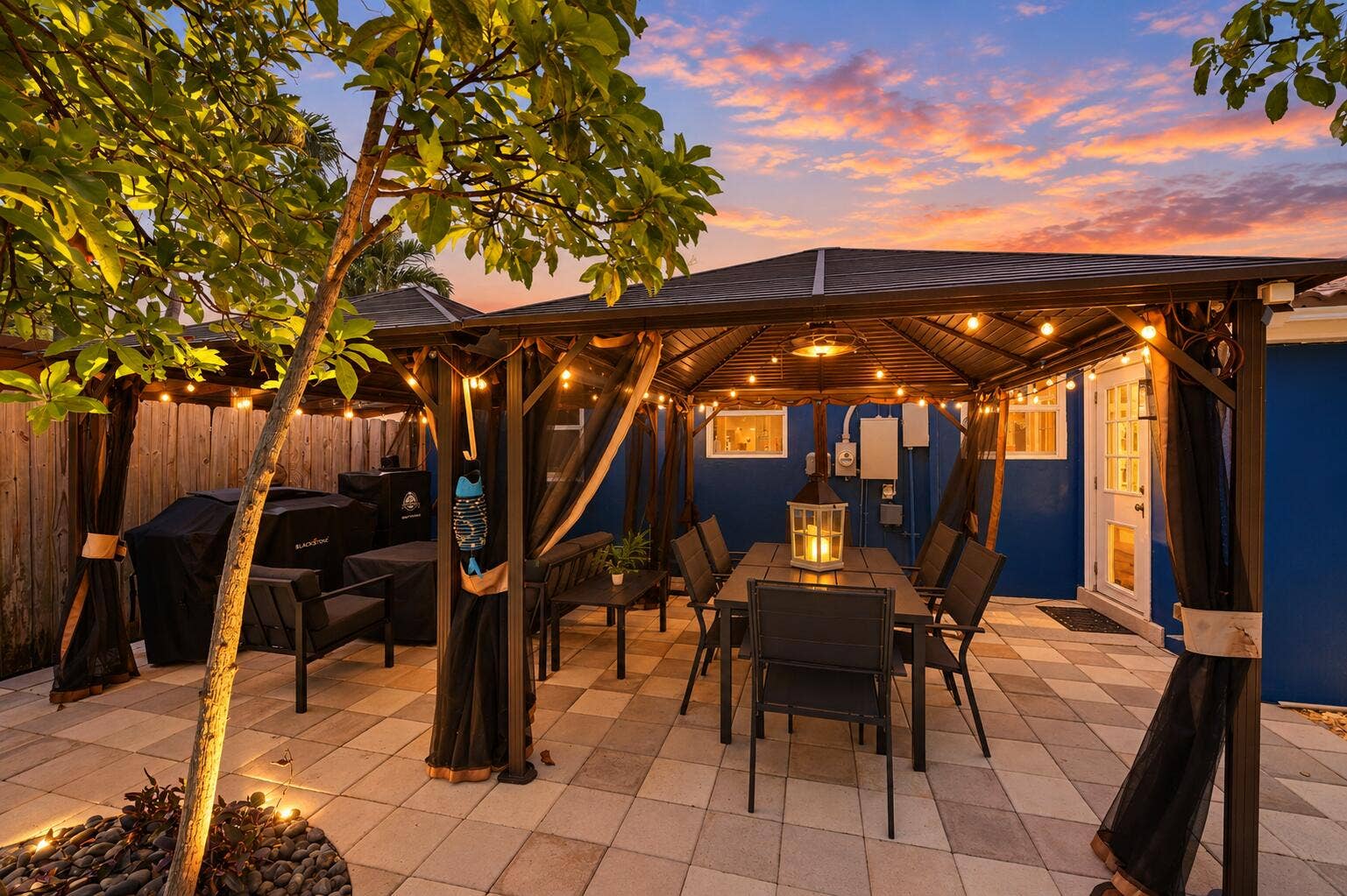 1421 SW 20 Street, Fort Lauderdale, FL 33315 Paved patio featuring a gazebo, privacy screens, and a lush green tree