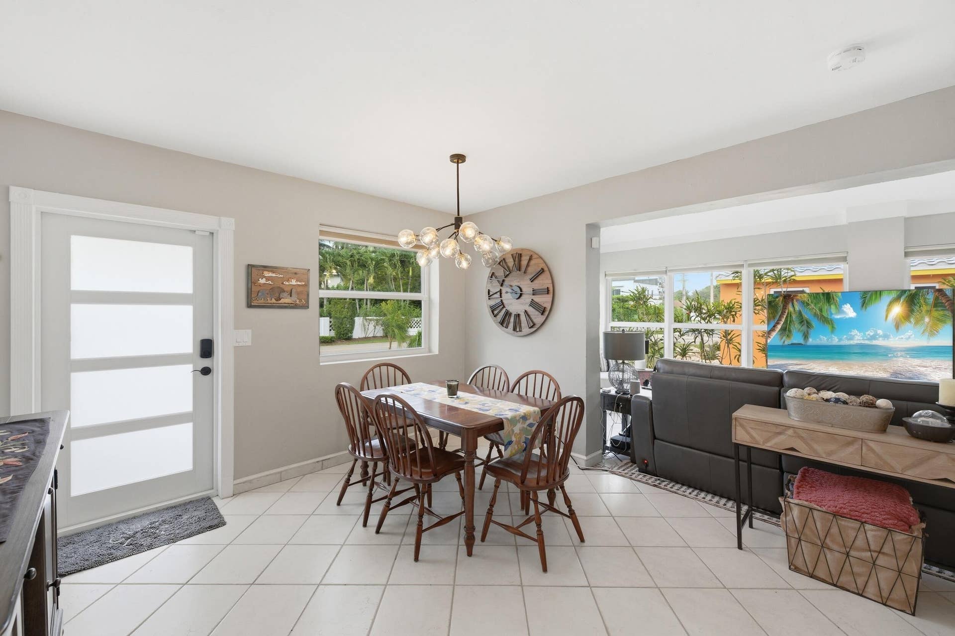 1421 SW 20 Street, Fort Lauderdale, FL 33315 Open-concept dining area featuring tile flooring, a contemporary chandelier, and a large window