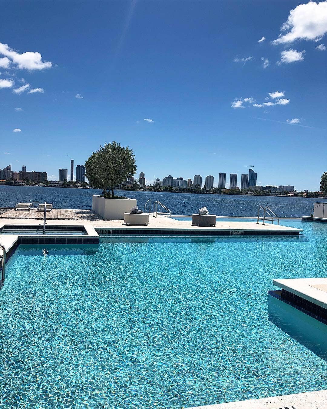 17111 BISCAYNE Boulevard, #1903, North Miami Beach, FL 33160 Expansive pool deck featuring a swimming pool, integrated hot tub, and water frontage