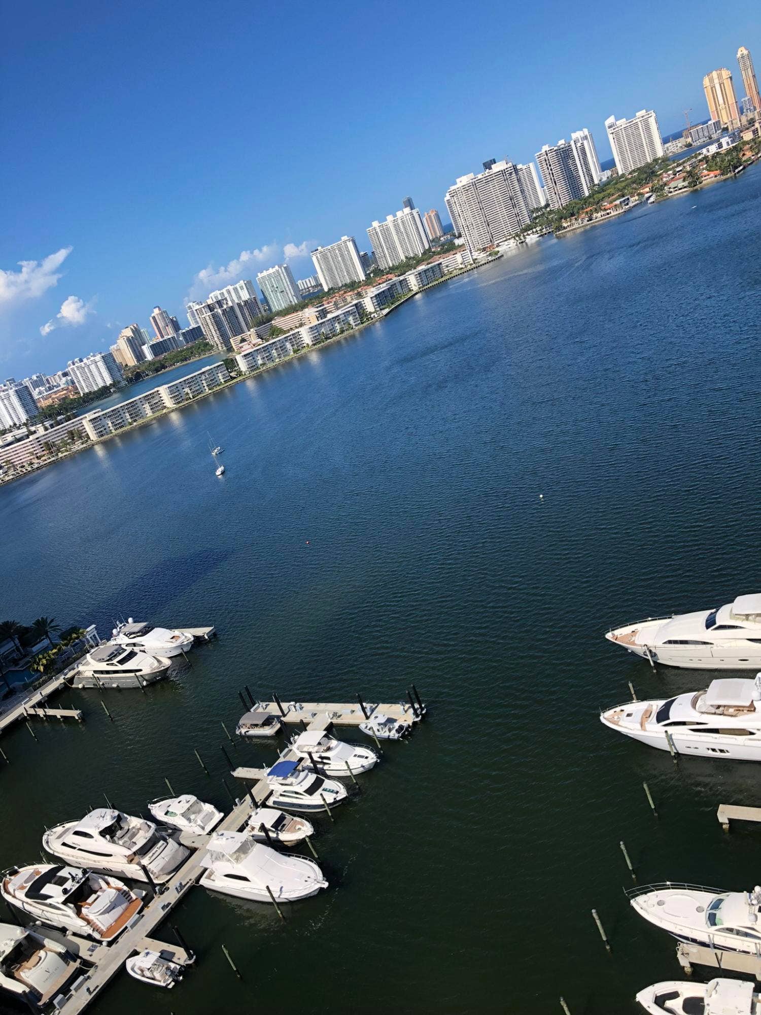 17111 BISCAYNE Boulevard, #1903, North Miami Beach, FL 33160 Waterfront marina featuring multiple boat slips and docked vessels