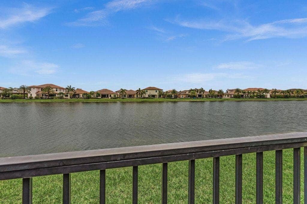 12143 S Baypoint Circle, Parkland, FL 33076 Expansive water body fronting a residential area with mature tropical plantings