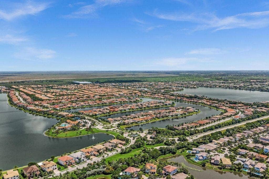 12143 S Baypoint Circle, Parkland, FL 33076 Expansive aerial capturing a master-planned community featuring numerous residential properties