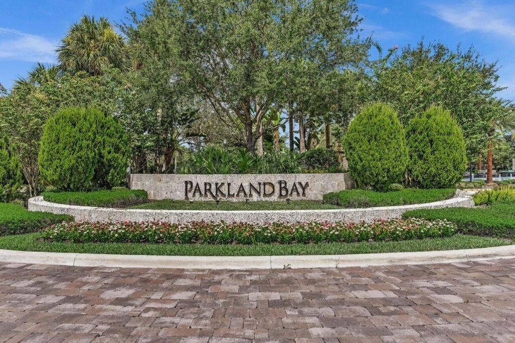 12143 S Baypoint Circle, Parkland, FL 33076 Stone entrance monument featuring "PARKLAND BAY" lettering