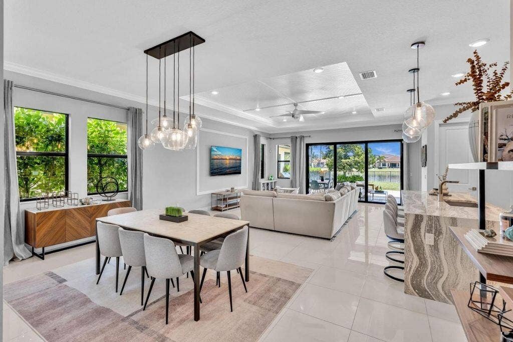 12143 S Baypoint Circle, Parkland, FL 33076 Open-concept living area with large format tile flooring and tray ceiling
