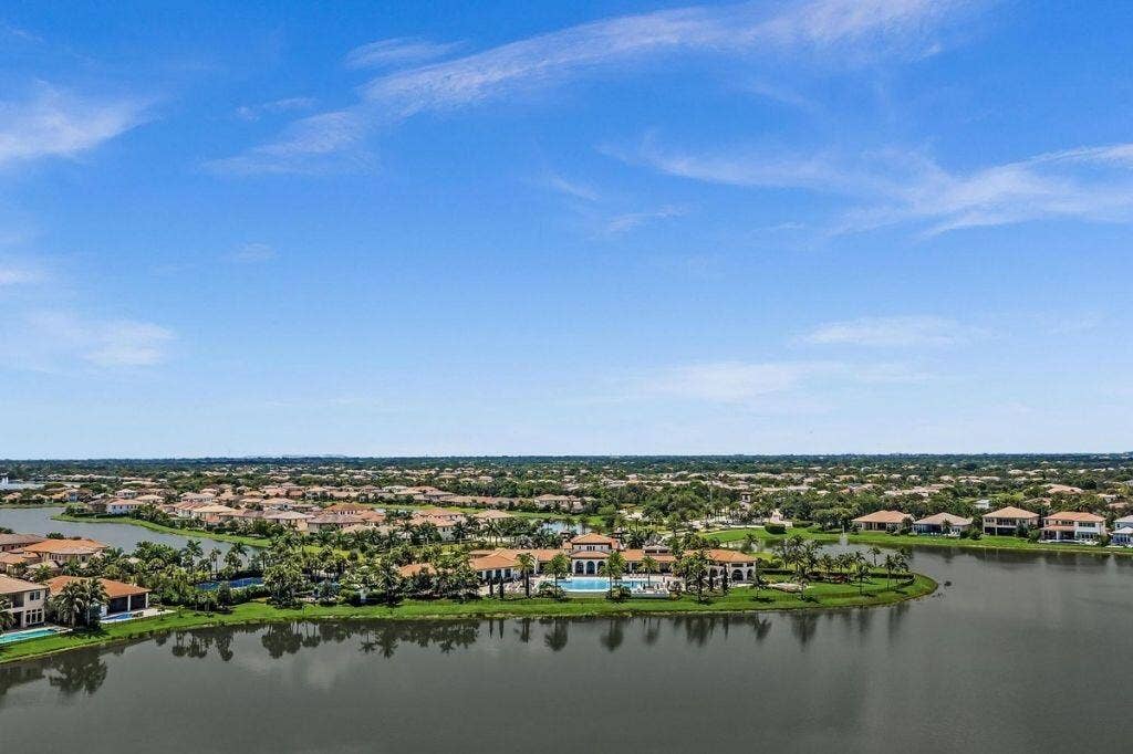 12143 S Baypoint Circle, Parkland, FL 33076 Expansive aerial showcasing a residential community with numerous properties featuring terracotta-style roofing
