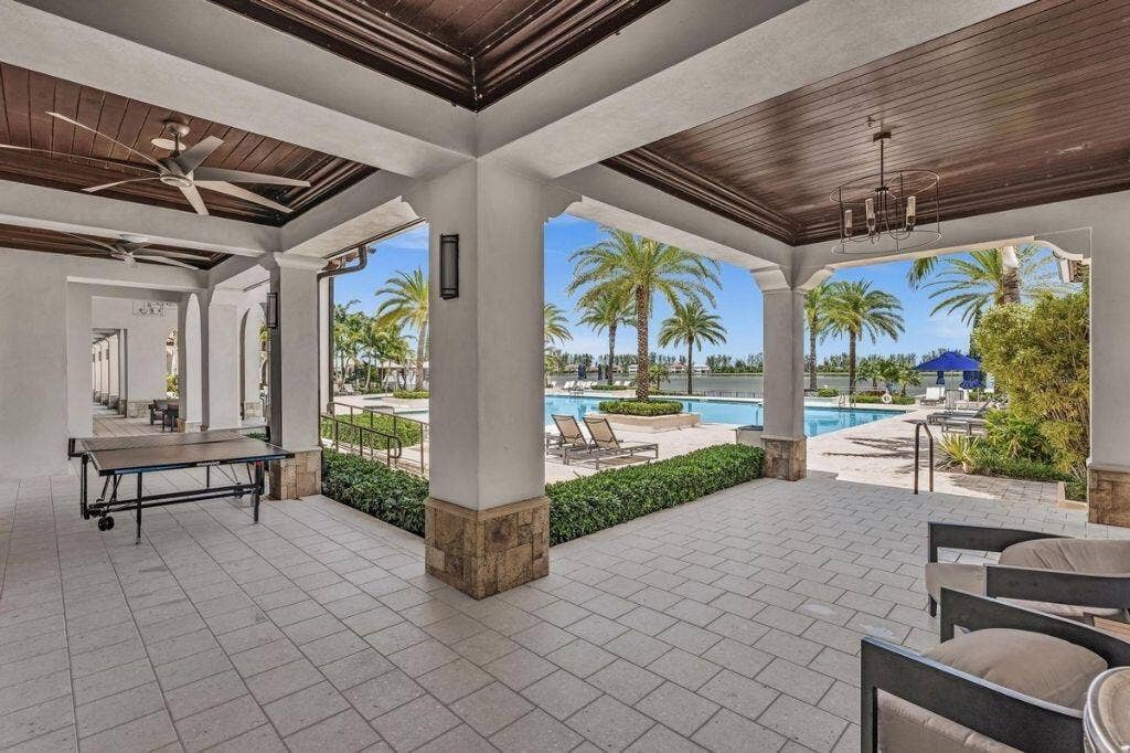 12143 S Baypoint Circle, Parkland, FL 33076 Covered outdoor patio featuring tiled flooring, decorative wood-paneled ceiling, recessed lighting, and ceiling fans