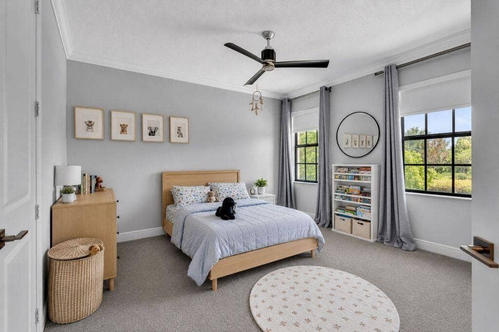 12143 S Baypoint Circle, Parkland, FL 33076 Spacious room featuring light gray walls, crown molding, and gray carpet