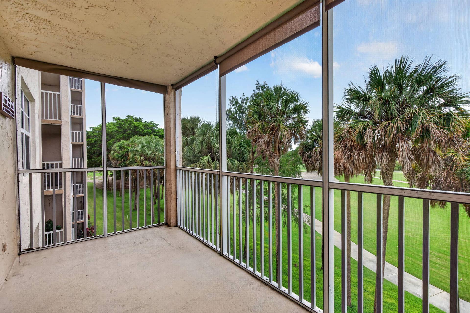 250 Jacaranda Drive, #411, Plantation, FL 33324 17 Screeened Patio with view of golf cou