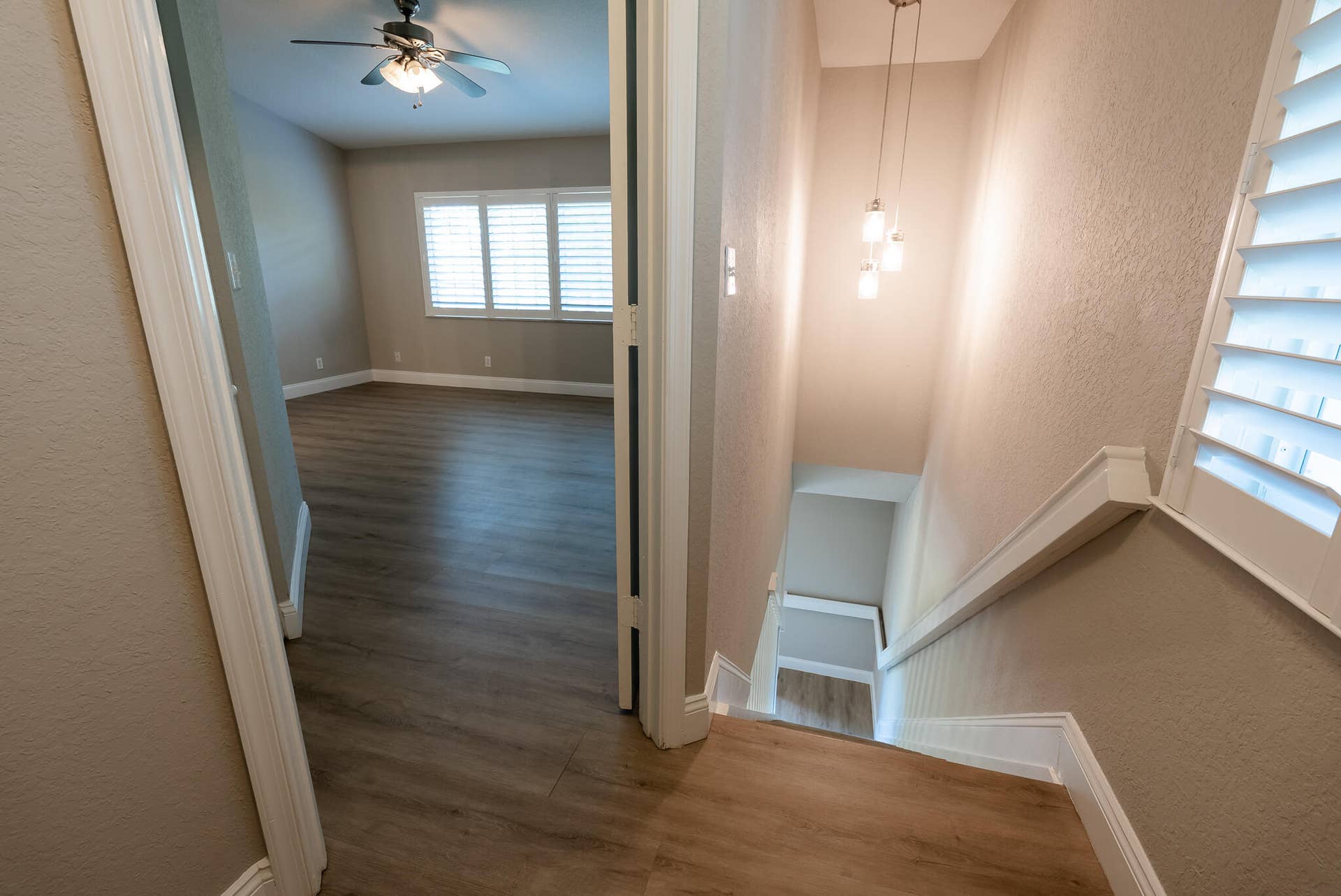 UPSTAIRS VIEW INTO PRIMARY BEDROOM